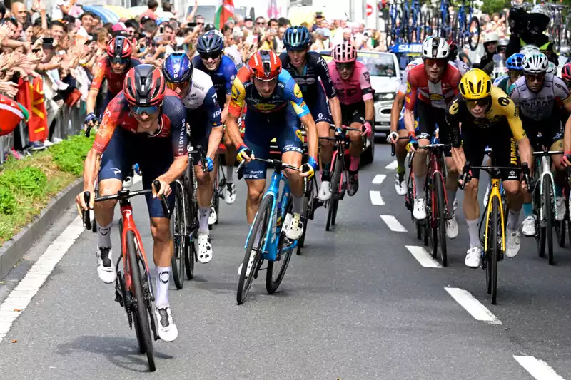 Tour de France stage 2 finale, road surface tacks cause mass punctures.