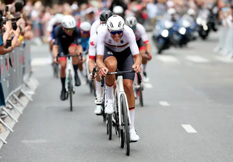 From "Amelie" to the Olympics--Nils Pollitt takes an emergency bathroom break at a famous Parisian cafe during a road race.